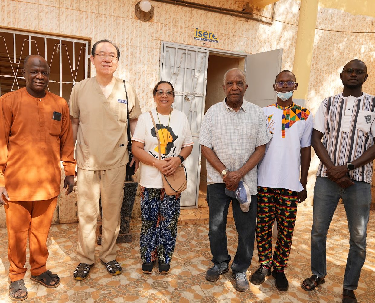 ACO staff standing shoulder to shoulder with local church and community partners in Senegal