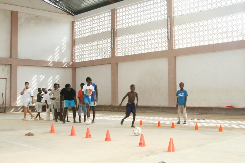 Photo 19. Orphans practice soccer in the orphanage gymnasium.