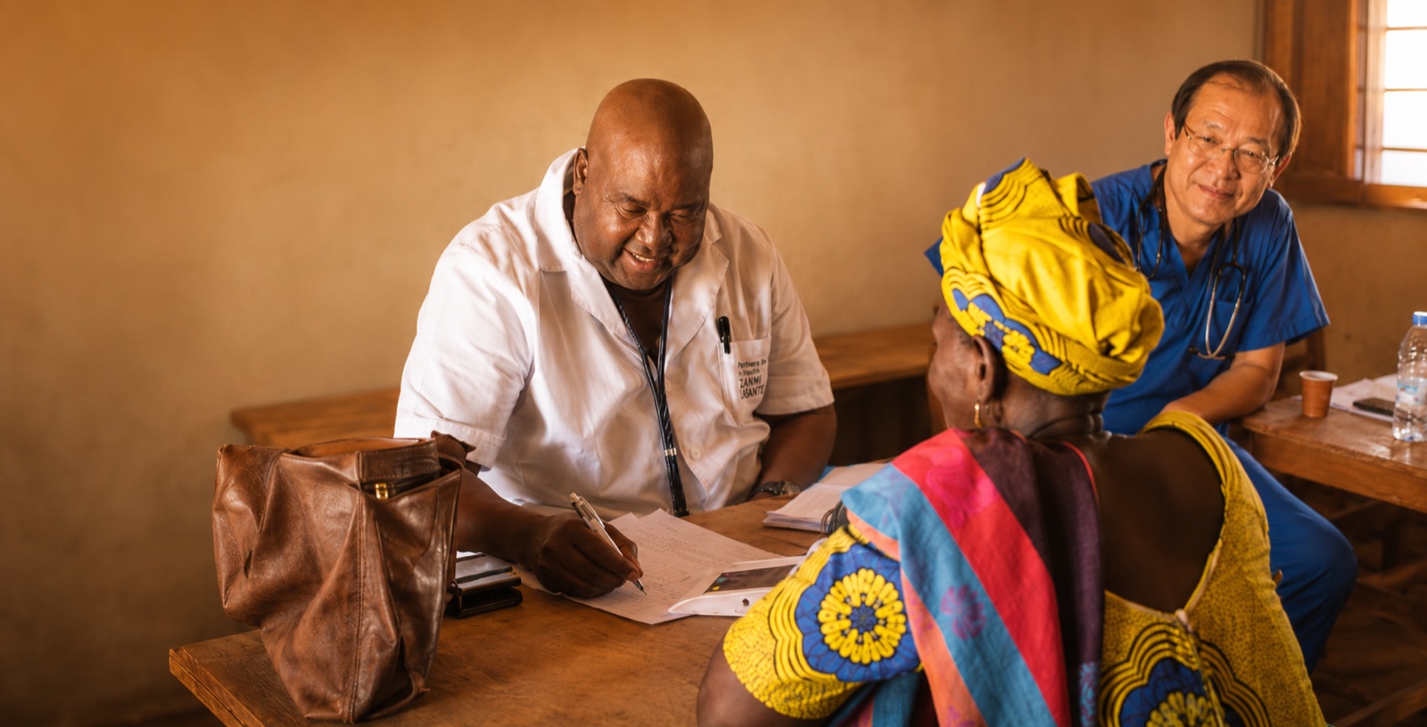 Dr. Idrissa Faye and Dr. Jun Xu serving a patient together in Senegal.