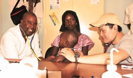 Figure 2: In 2013, Dr. Faye taught my son Lufei Xu to auscultate the child. Lufei Xu, MD, was a first-year medical school student at the time.