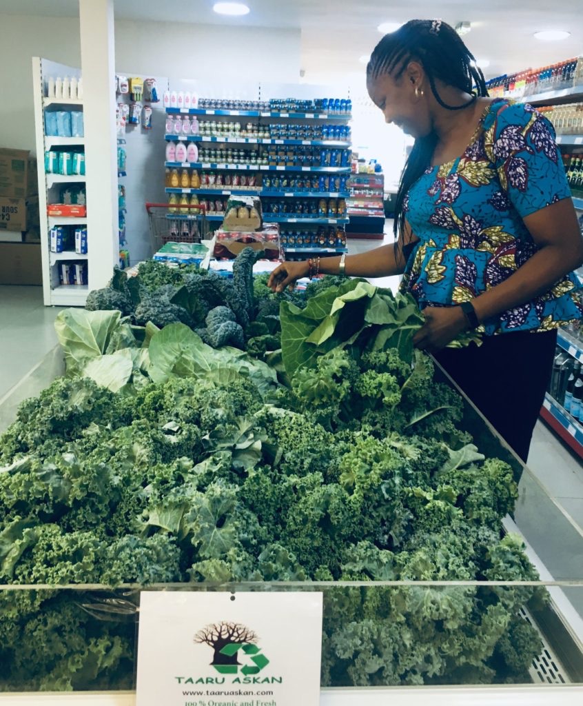 Customer checking out Taaru Askan produce.