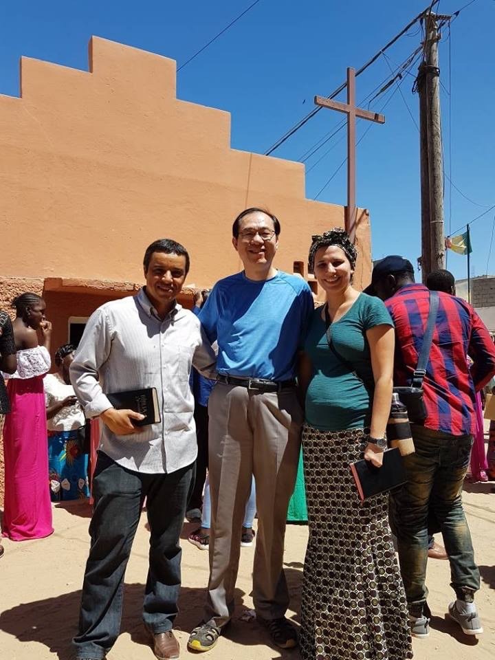 Fig 8. At the entrance of the first church built by Pastor Otávio Marques: Dr. Jun Xu, Pastor Anderson and Ms. Andressa.